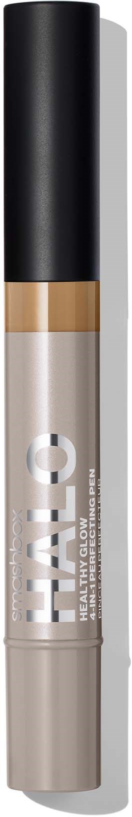 A makeup concealer product with a black cap, beige tube, and bold text on it.