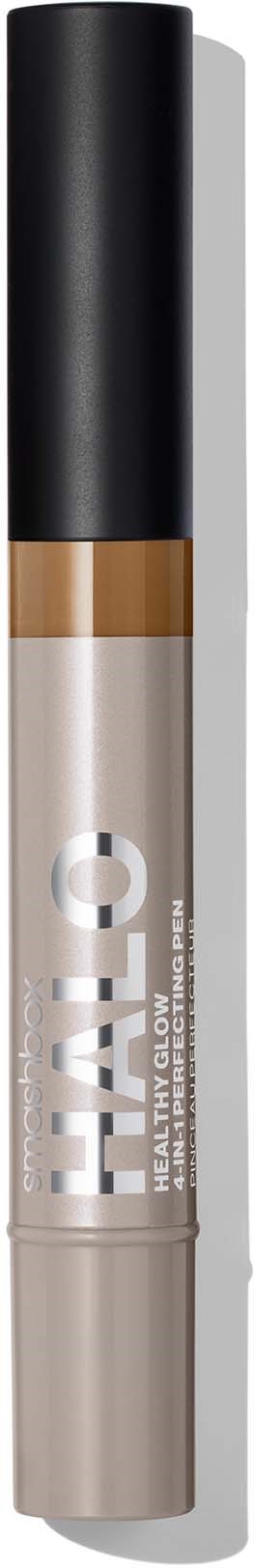En concealer-stift med svart hette, beige midtdel, og gjennomsiktig bunn som viser produktdetaljer.
