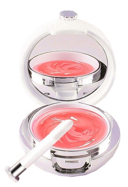 A round compact with a mirror, a small container of pink cream, and a white applicator stick inside.