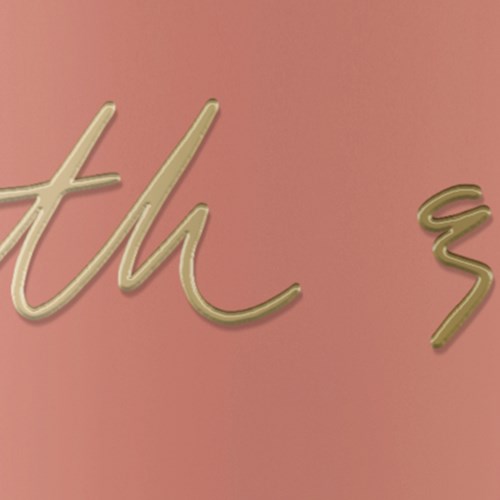 Gold-colored cursive text on a pink background.