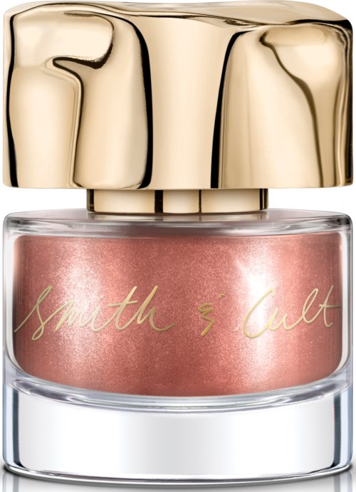 A small jar with pink cream, gold cap, and handwritten text on the label.