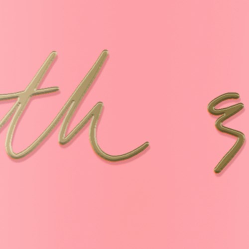 A neon sign with cursive writing on a pink background.