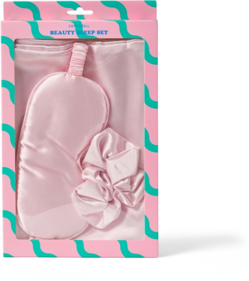 Valkoinen unilappu ja hiuslenkki pakkauksessa, lukee 'Beauty Sleep Set.'