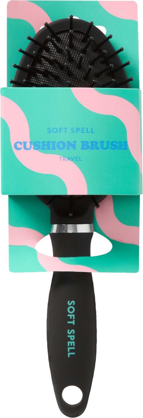 En svart hårborste med en blå och rosa förpackning som säger "Soft Spell Cushion Brush."