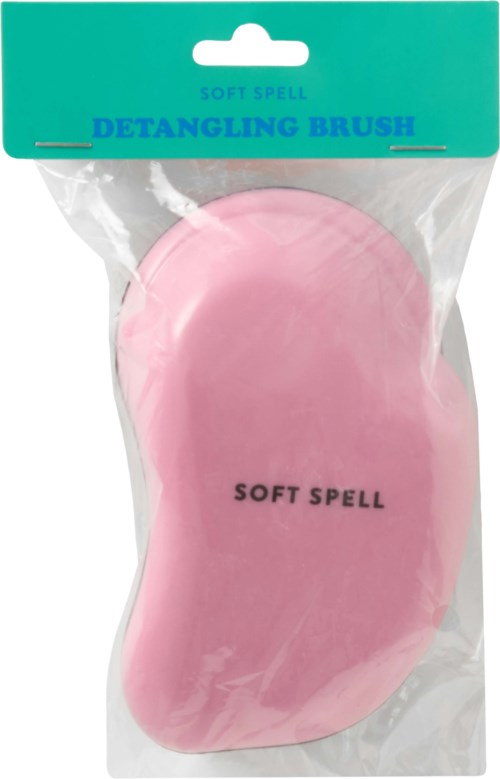 En rosa myk spell-børste for å gre ut hår i plastemballasje med grønn etikett.