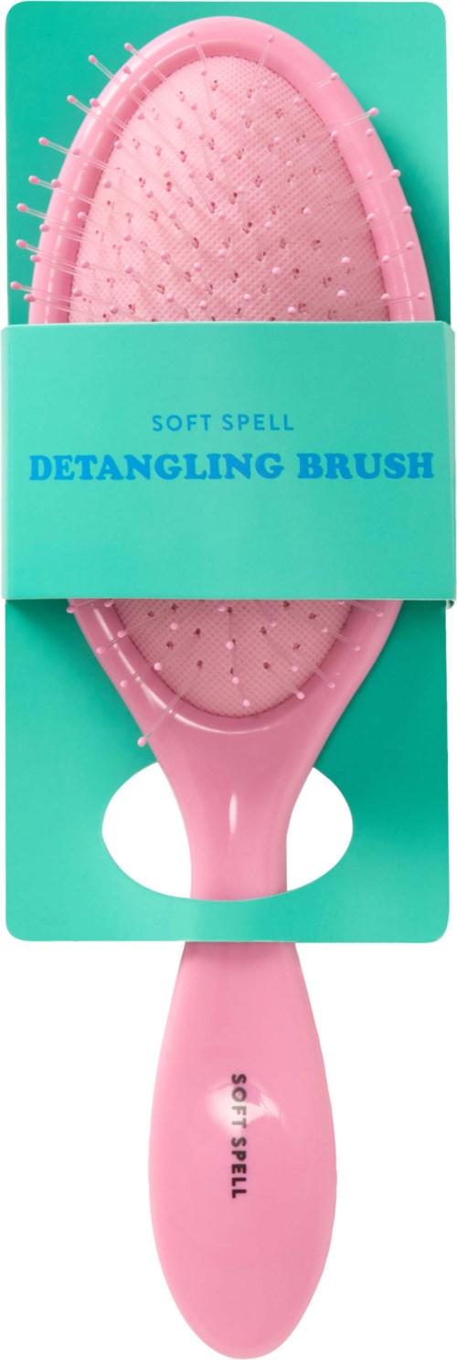 Pink detangling brush with soft bristles, in turquoise package labeled 'Soft Spell Detangling Brush.'