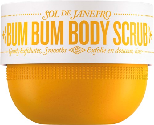 Een gele container met een witte deksel die zegt 'BUM BUM BODY SCRUB' voor exfoliëren en glad maken van de huid.