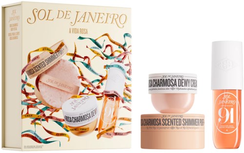 Box med Sol de Janeiro-logga och färgglada band, hudvårds- och makeupprodukter framför, inklusive en burk och ett nagellack.