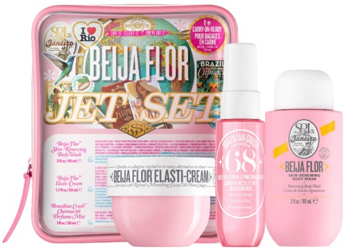 A beauty set with a pink bag, cream, body wash, and small spray bottle, all labeled with pink and white design.