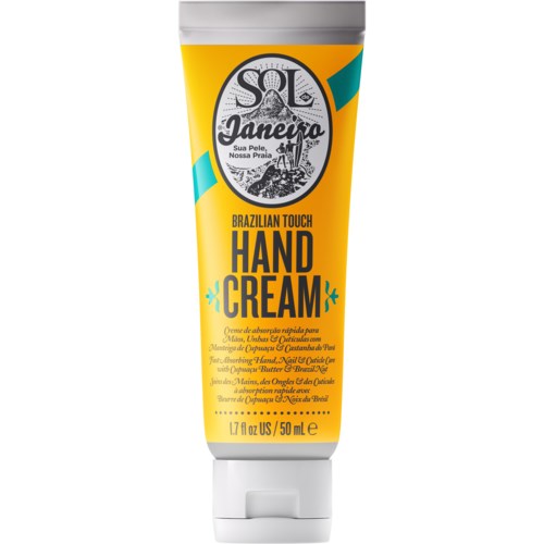 En gul tube håndcreme med sorte, hvide og teal etiketter, med mærket 'Sol Janeiro' og produktdetaljer.