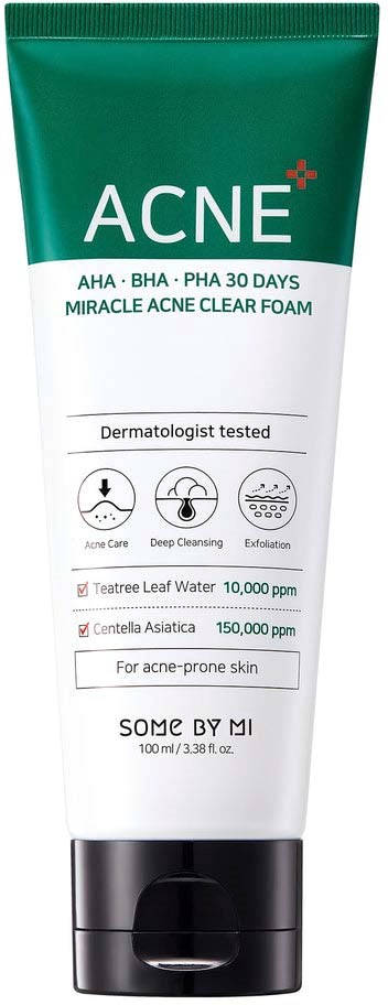 Green and white tube of acne cream with labeled ingredients and usage instructions.