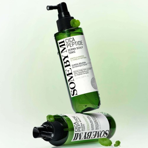Two green bottles of scalp toner with black spray caps, one standing and one lying down. Product labels mention Cica Peptide.