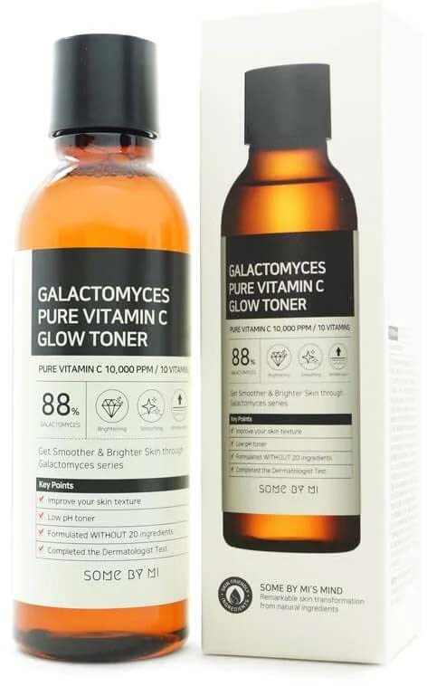 An amber bottle and box of Galactomyces Pure Vitamin C Glow Toner. Bottle has black cap, label with product details. Box displays the same info.