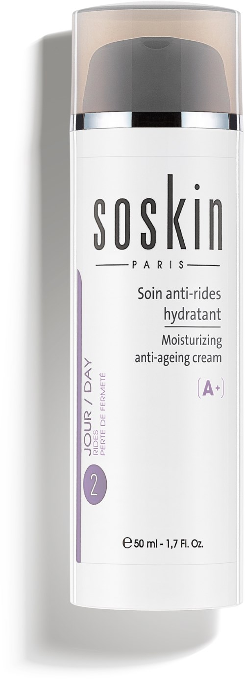 En hvit flaske med grå hette og lilla detaljer, merket som fuktighetsgivende anti-aging krem fra Soskin.