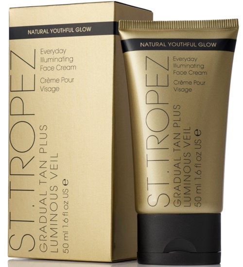 Guldfärgad tub och förpackning för ansiktskräm, märkt 'St. Tropez' och 'Gradual Tan Plus Lumi?e Veil'.