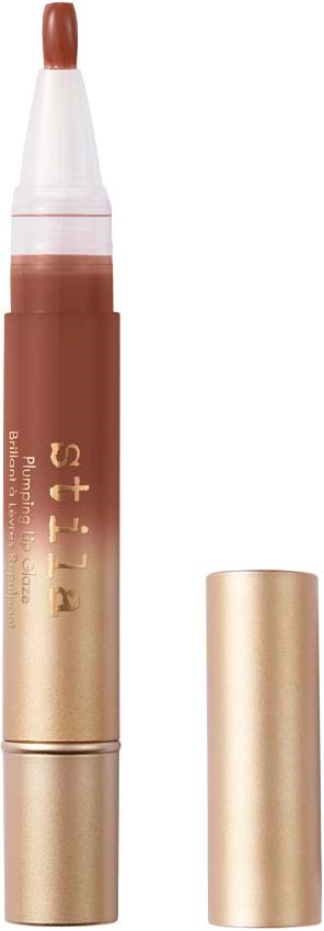 Ett sminkstift med brun läppstift och guldkapsel, märkt 'Fit me'.