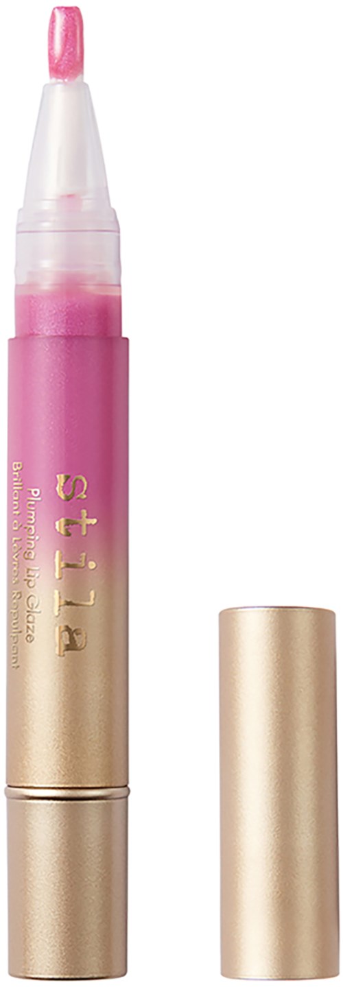 En rosa og gull tube med lokk, sannsynligvis leppeglans eller highlighter, står opp med lokket ved siden av.