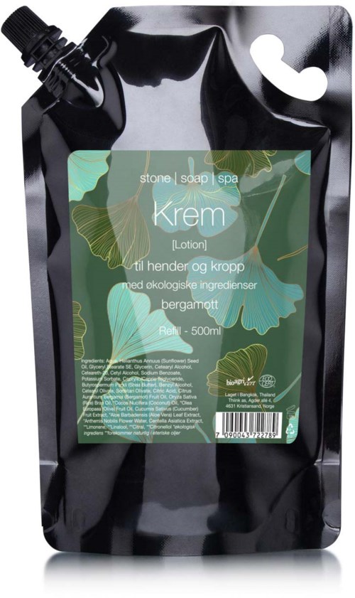 En svart påfyllningspåse med en grön etikett för kroppslotion med ekologiska ingredienser och bergamot.