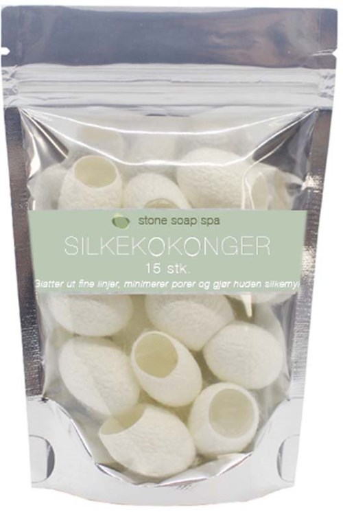 Clear plastic bag containing white bath bombs with a label for silk cocoon soap spa.