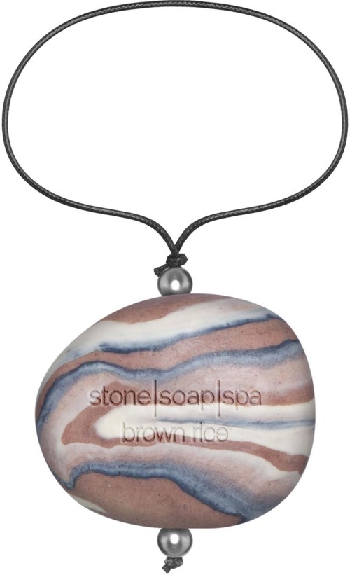 Saippuakoru, jossa marmoroitu kivi ja sanat "stone soap spa" ja "brown face" kaiverrettuina.