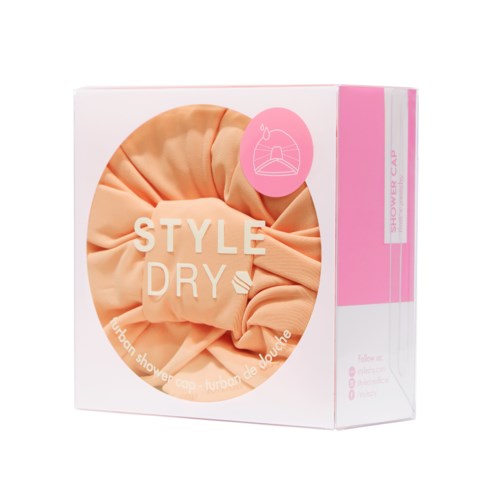 Eske med ferskenfarget dusjhette, merket "STYLE DRY," for hårtørking etter dusj.