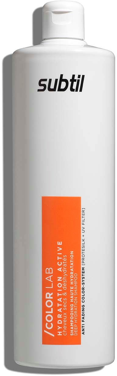 En hvid flaske med sort tekst og en orange rektangel, sandsynligvis en hårfarve eller kosmetikprodukt.