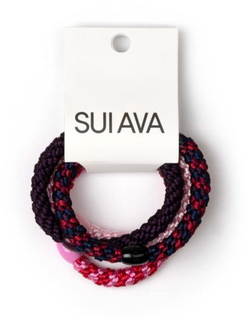 Colorful fabric hair ties on a white card labeled SUI AVA.