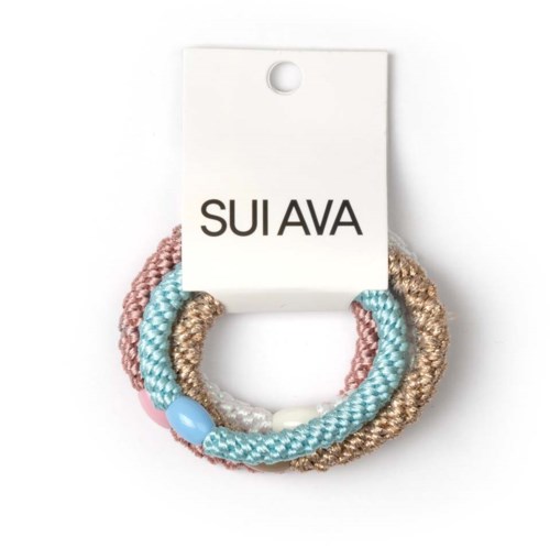 Set of three colorful hair ties on a white card with the brand name SUI AVA.