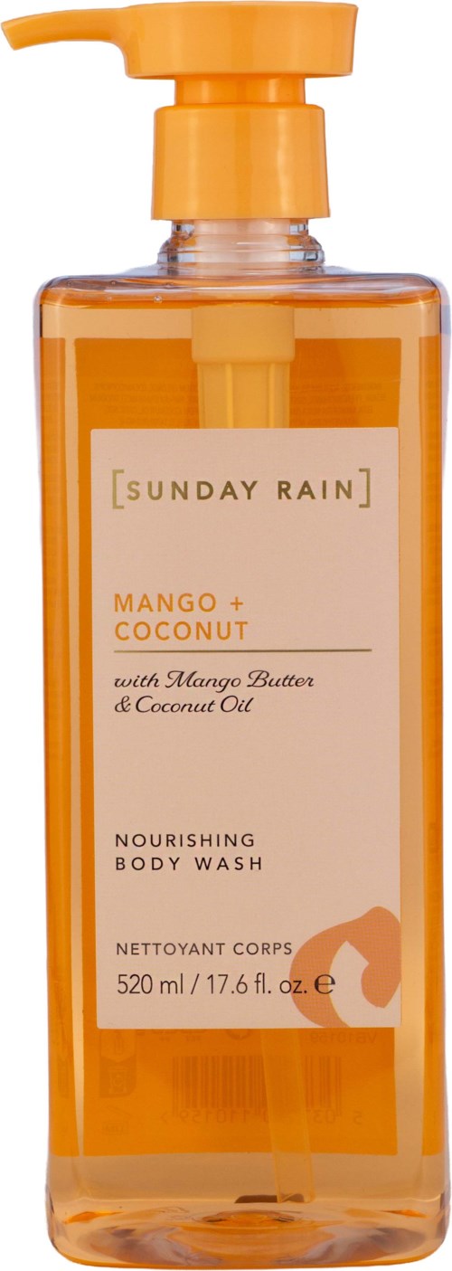 En gennemsigtig orange flaske med pumpe og en label med Mango + Coconut nærende krobvask og duftdetaljer.