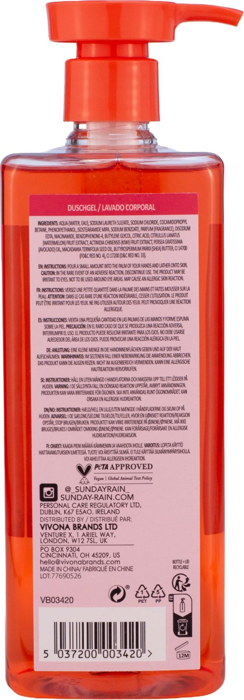 En lang oransje væske såpedispenser med pumpe og detaljert etikett med tekst.