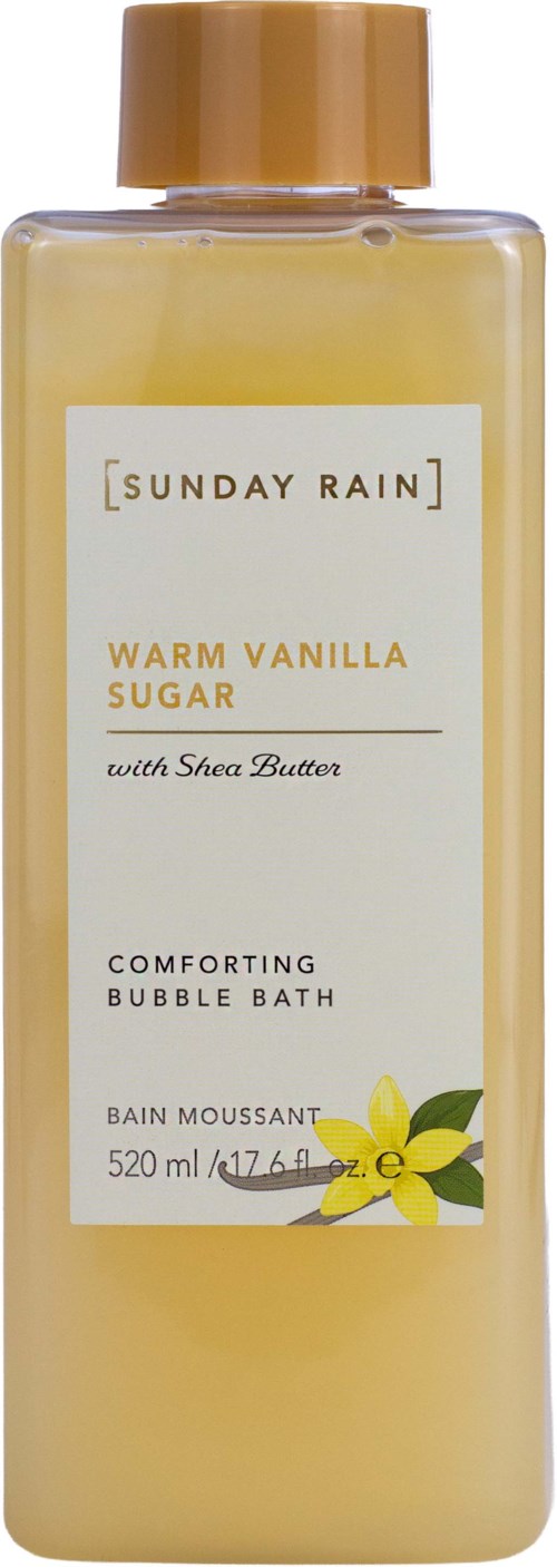 A bottle of Comforting Bubble Bath with a white label, gold cap, and vanilla flower illustration.