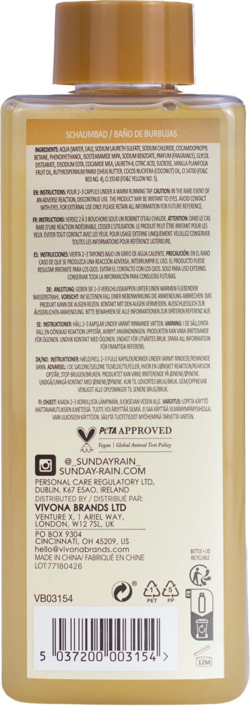 Back view of a beige bottle with a gold cap, showing product details, ingredients, and logos on the label.