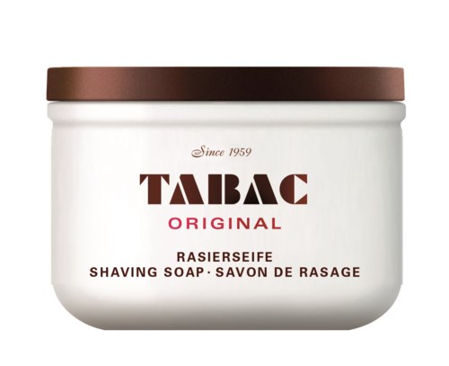 Ett vitt burk med brun kork som innehåller Tabac Original raksoap, märkt på flera språk.