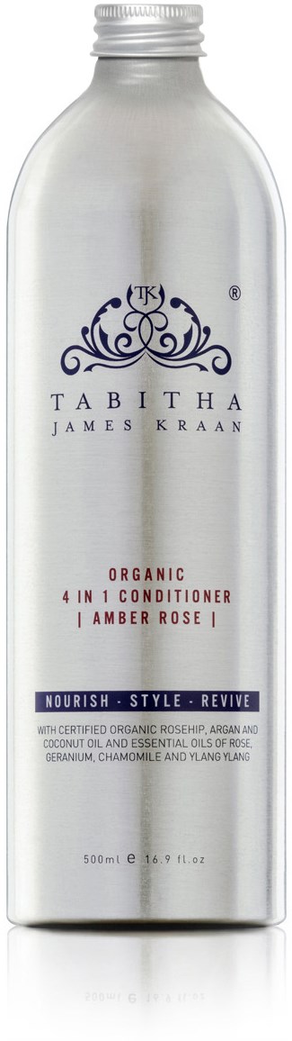 En sølvfarget flaske med en detaljert logo, merket 'Tabitha James Kraan', som beskriver en økologisk 4-i-1 balsam for å pleie håret.
