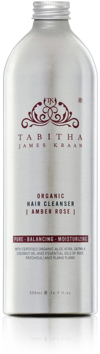 Een wit flesje organische haarreiniger met label "Tabitha van James Kraan, Amber Rose, Pure, Balancerend, Voorkomend."