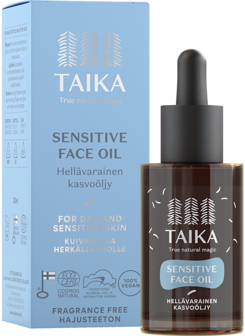 Niebieskie pudełko i ciemna butelka z kroplomierzem, etykieta mówi Taika Sensitive Face Oil do suchej i wrażliwej skóry.