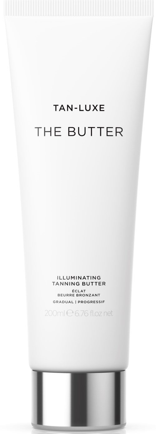 En vit tub märkt 'Tan-Luxe The Butter' med silverlock, beskriver lysande brun utan sol-kräm för gradvis, naturlig lyster.