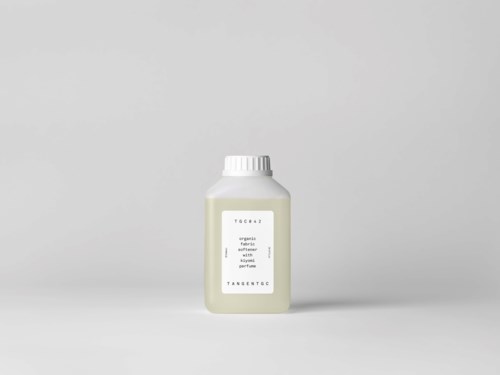 A small white bottle labeled 'Tangent' stands alone on a light background.