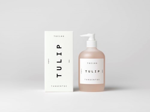 A pink lotion bottle with a pump next to a white box, both labeled 'TULIP'.