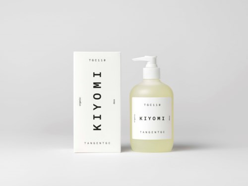 A white box and a pump bottle of skincare product with simple black and white labels, minimal design.