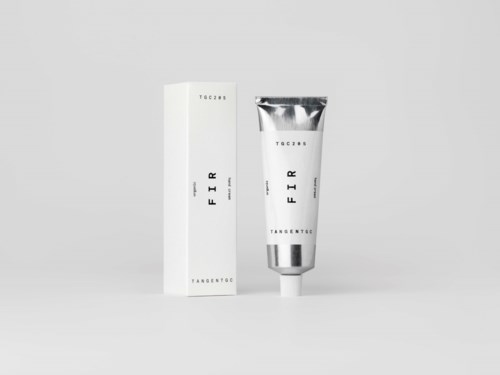 A white and silver tube of skincare product with matching box, displaying minimal text and sleek design.