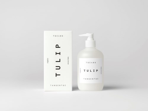Valkoinen pumppupullo ja vastaava valkoinen laatikko, molemmissa lukee "TULIP."