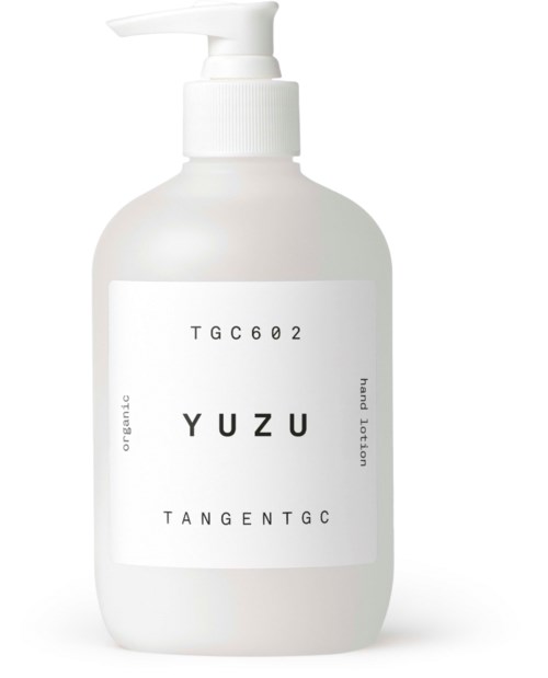White lotion bottle with a pump and simple label, showing YUZU and other small text.