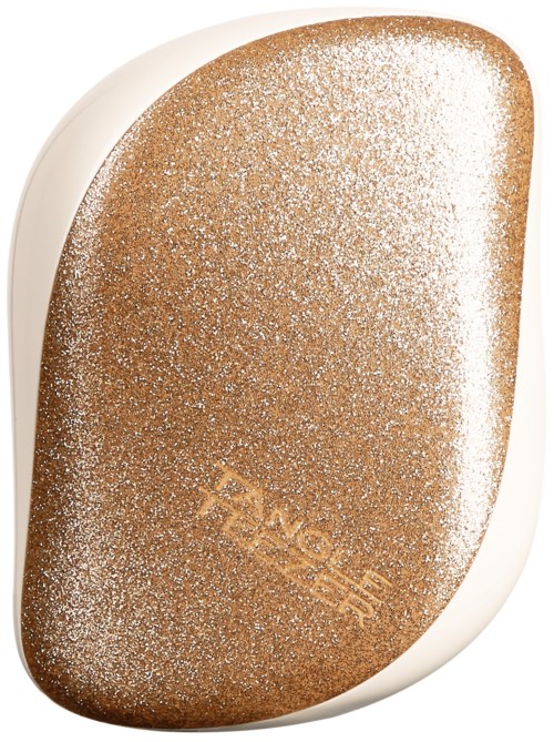 A white and gold makeup sponge with a dusting of powder and the brand name 'FxE' on it.
