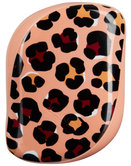 A leopard print case with black and red spots on a peach background.