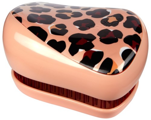 The heart-shaped case has a peach color with a leopard print pattern on the lid.