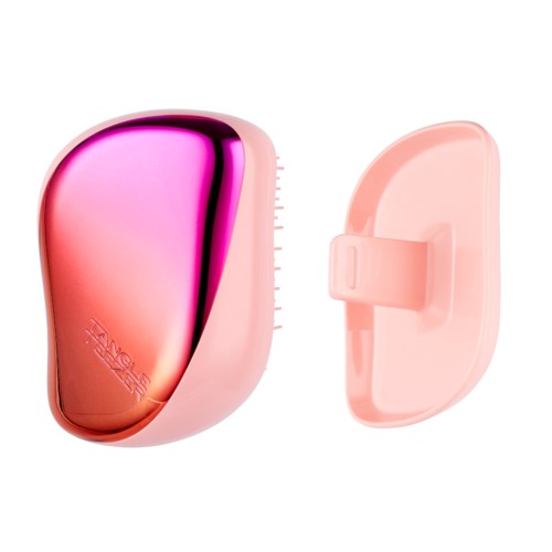 A pink and black handheld device with a screen, attached to a pink stand or mouse. It appears to be a tech gadget.