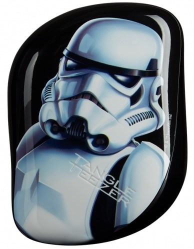 A black rectangular object features a detailed, realistic Stormtrooper helmet from Star Wars on its surface.