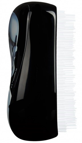 This is a black hairbrush with white bristles. The handle is smooth and shiny.