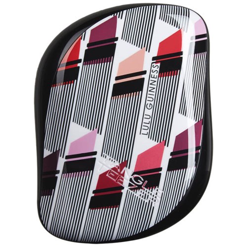 A small, patterned square container with abstract black, red, and pink lines and shapes. The name 'Lulu Guinness' is on it.